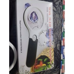 Lupa de Mão e livro Conhecendo Fontes Chaveadas.